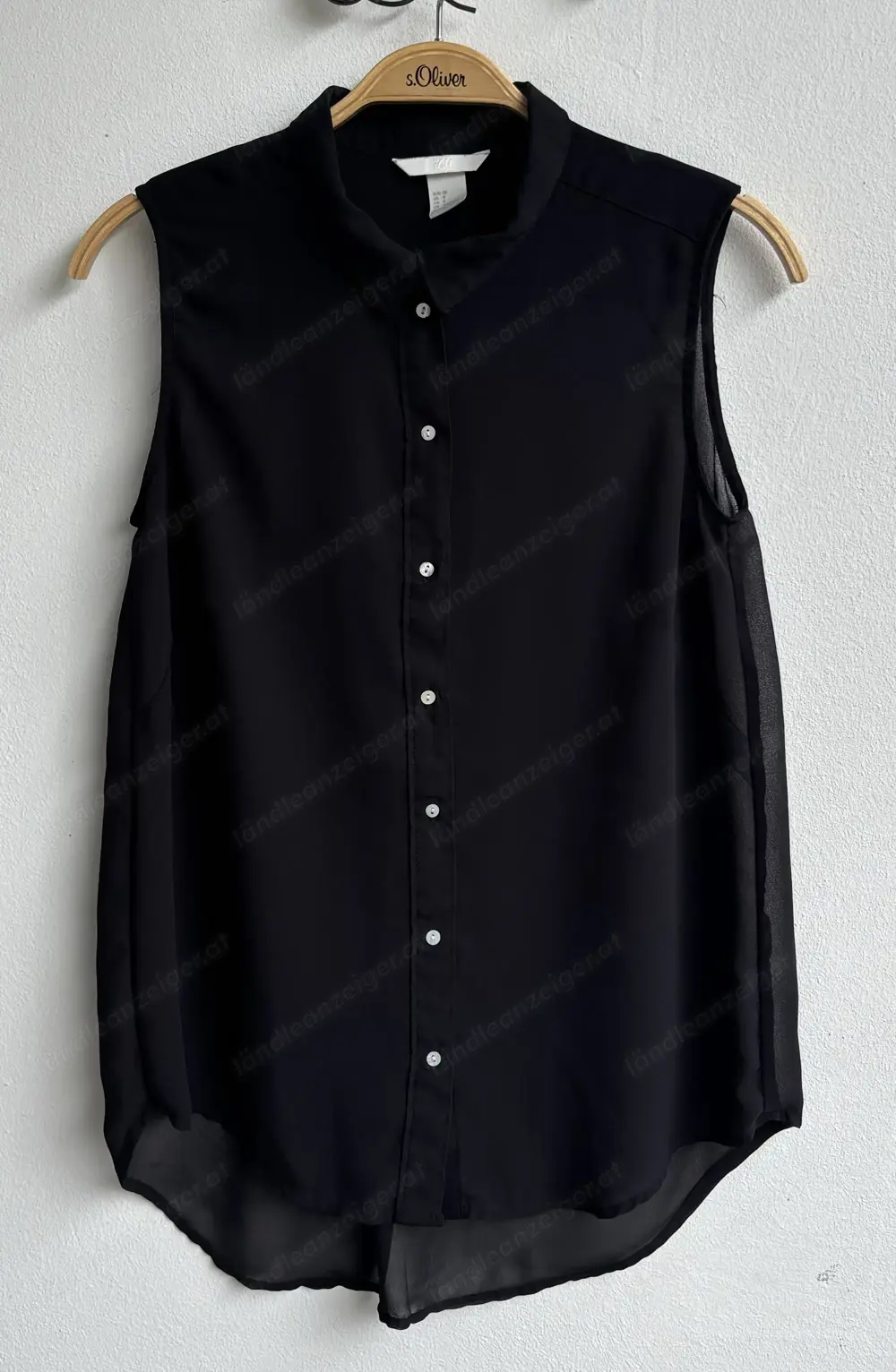 Schwarze, transparente ärmellose Bluse von H u M Schwarze, transparente ärmellose Bluse von H u M