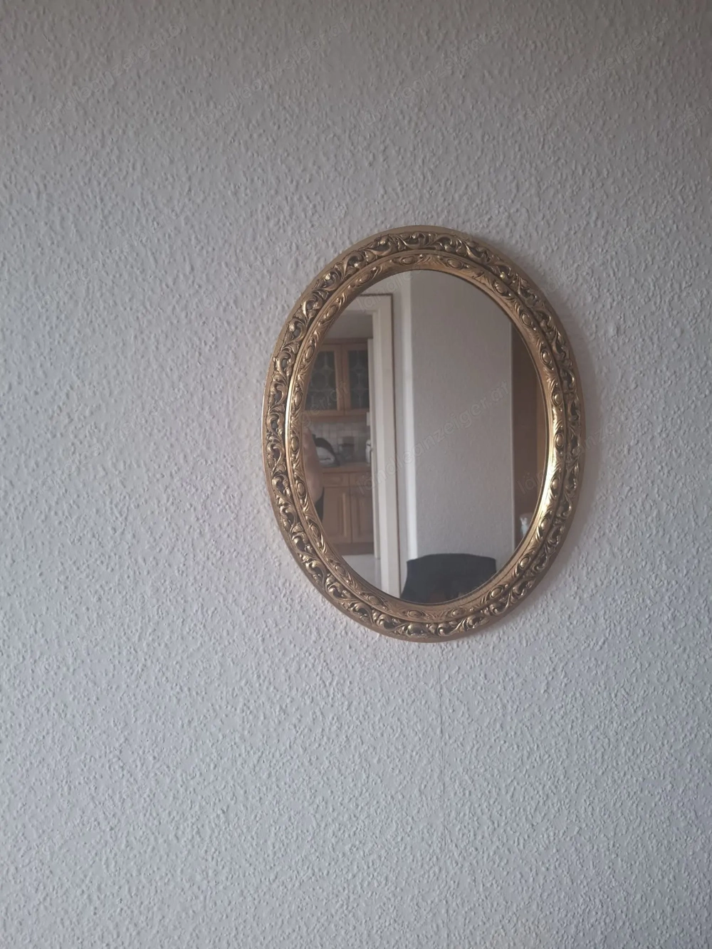 Verschnörkelter Wandspiegel