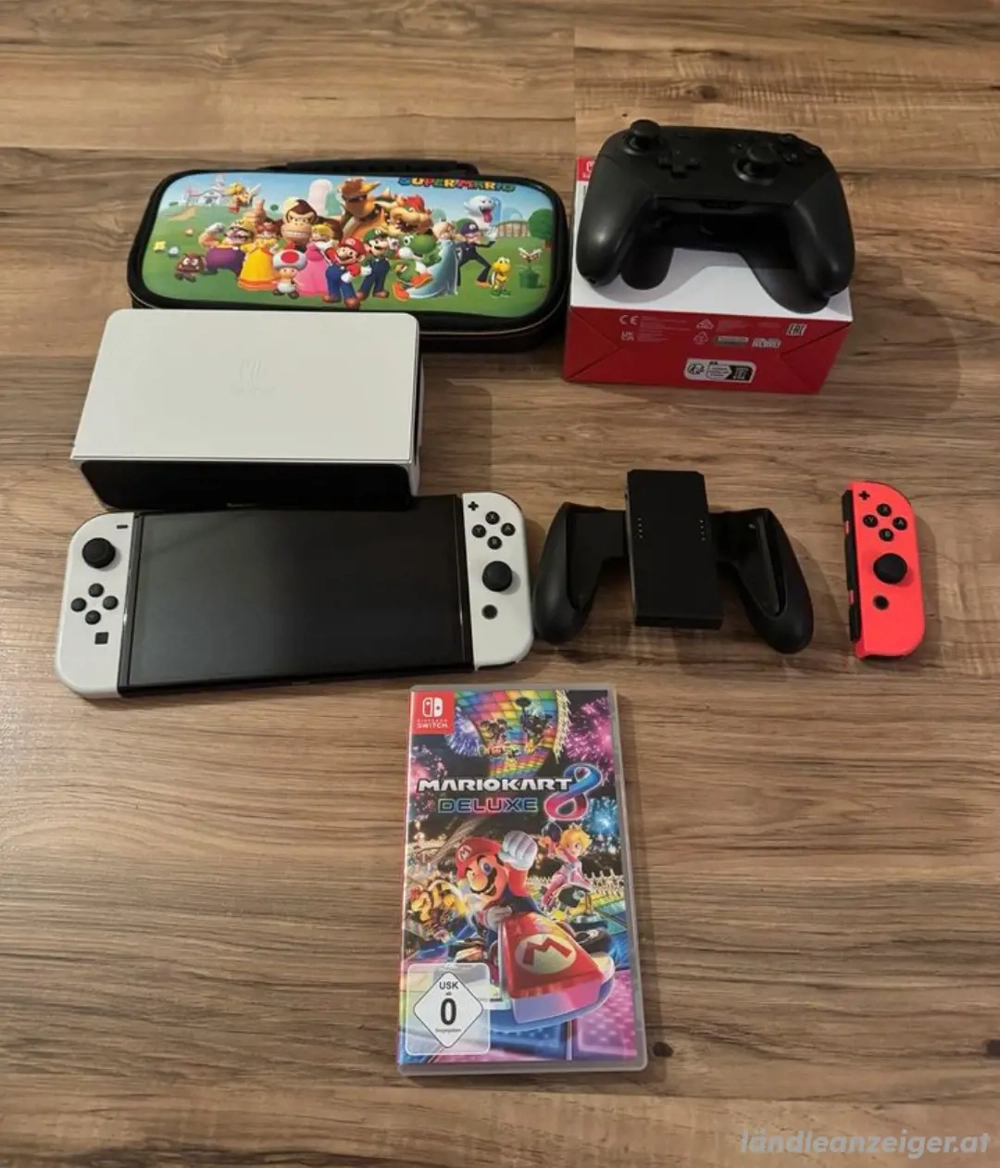 Nintendo Switch OLED +16 Spielen+Pro controllers 