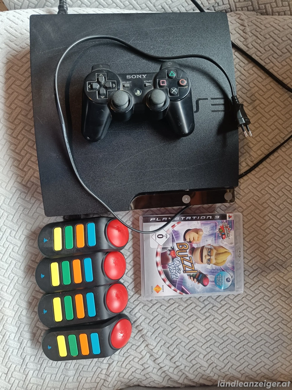 PS3 mit Controller und Buzz!