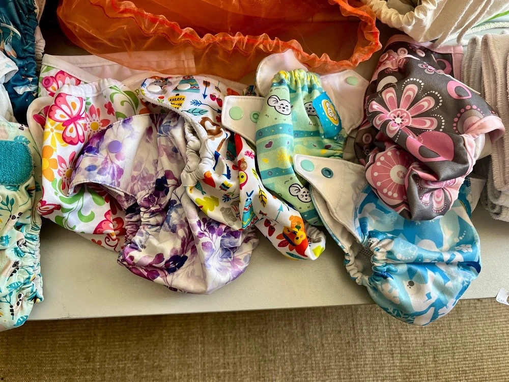 Stoffwindeln, auch AIO, Einlagen (Bambus oder Biobaumwolle), wetbags