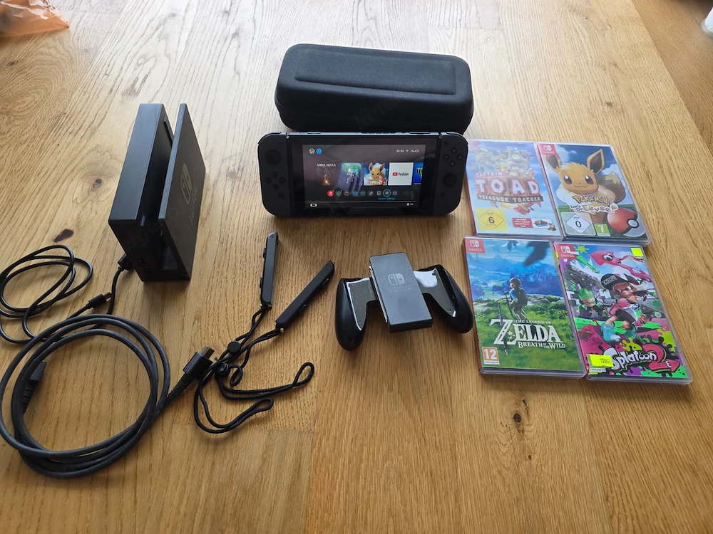 Nintendo Switch Komplettset + 4 Spiele + Zelda Amiibo + evtl. ungepatcht