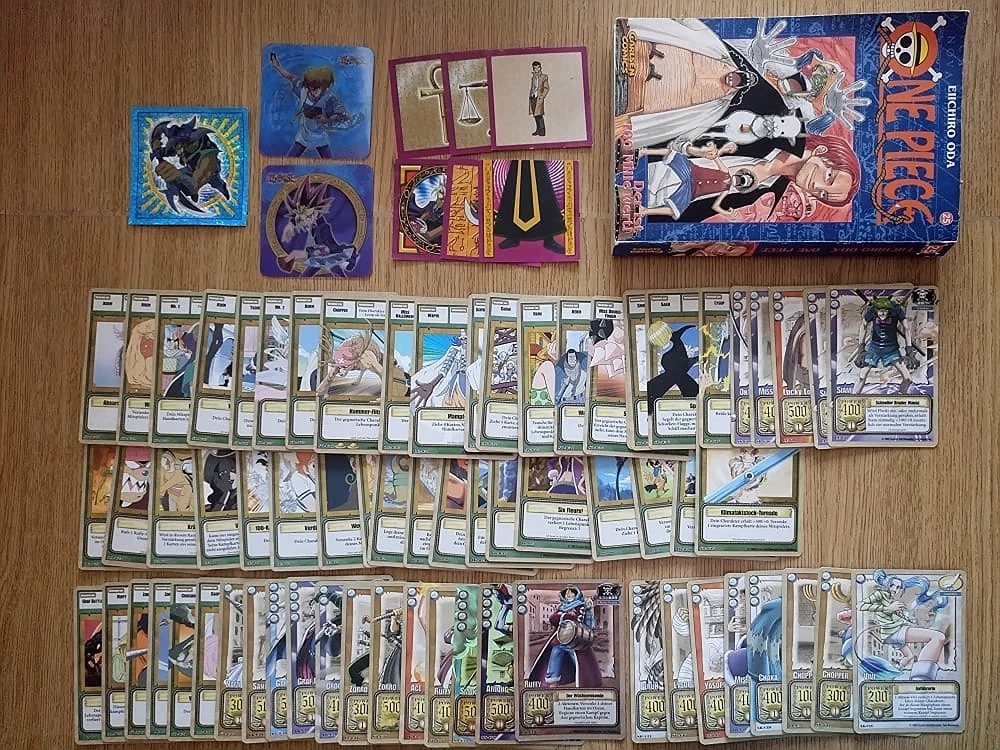 One Piece TCG Vintage (Bandai, Amigo 2002) + Manga Band 25 + Yu-Gi-Oh! Merlin Sticker & 3D Bilder