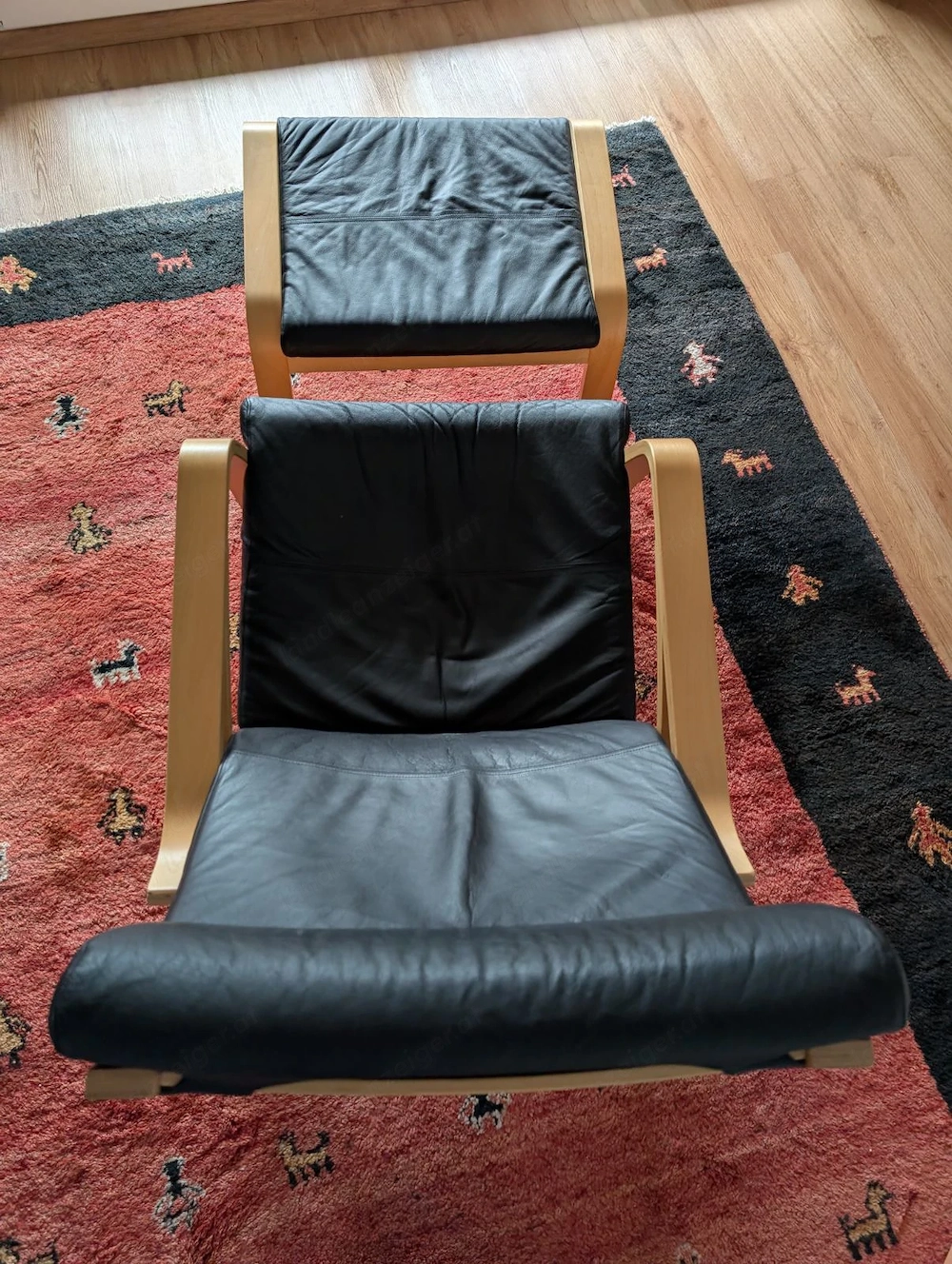POÄNG Schwingsessel mit Fußteil LEDER schwarz