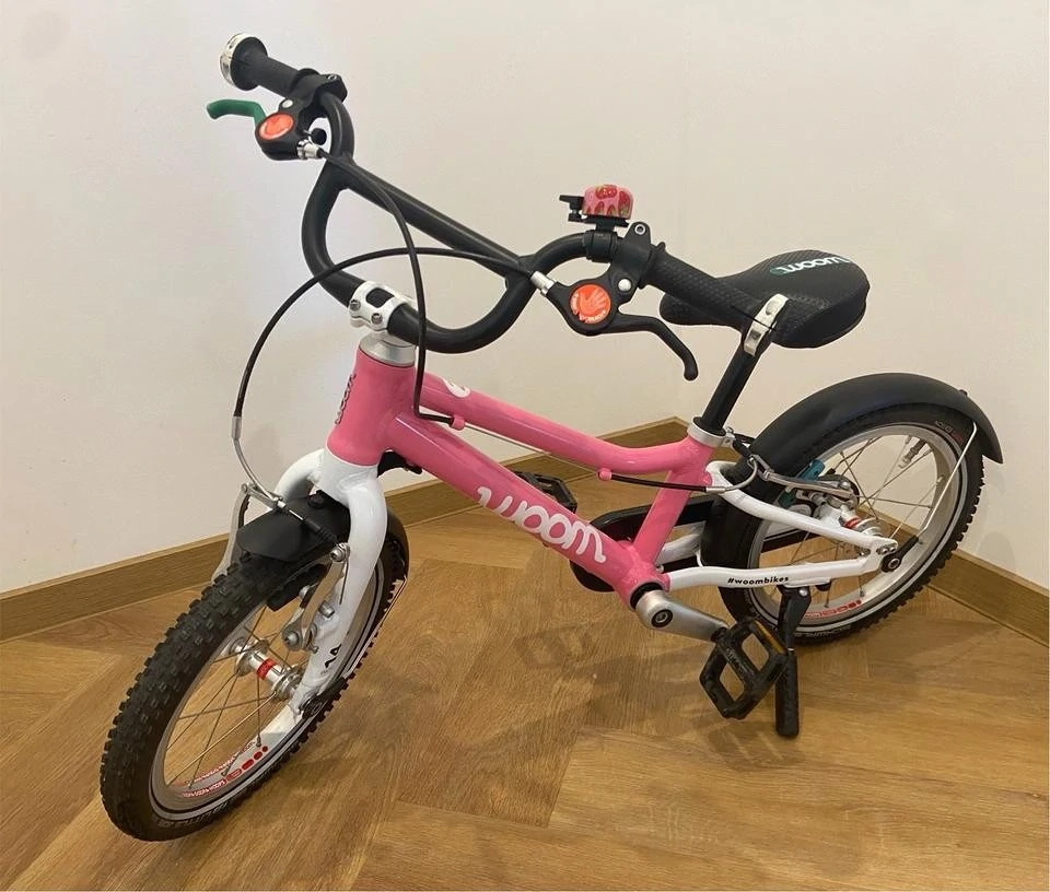 Woom 2 Kinderfahrrad pink, 14 Zoll, mit Schutzblechen & Ständer
