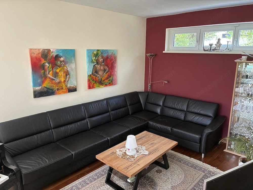 Grosse schwarze Ledercouch zu verschenken.