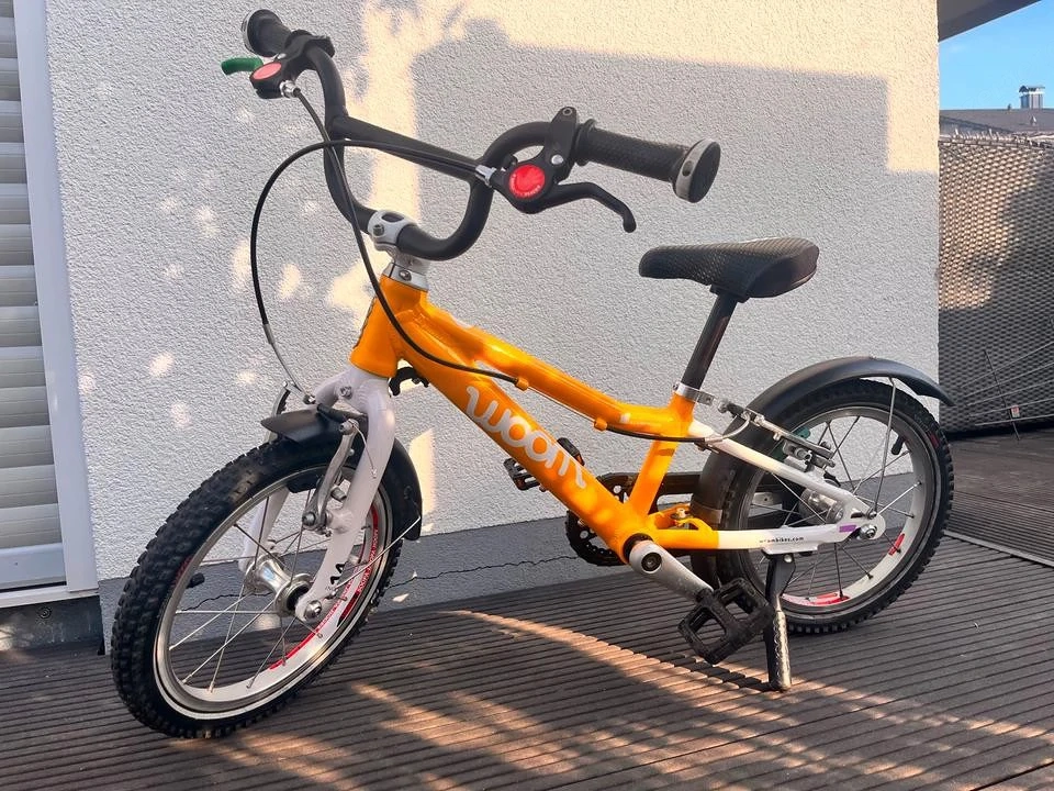 Woom 2 Kinderfahrrad orange mit Schutzblech & Ständer