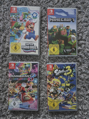 Nintendo Switch OLED 64GB - Weiß + Spiele & großes Zubehörpaket Bild 4