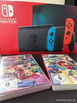 Nintendo switch spielkonsole mit OVP + Mario kart und super Mario party  , zustand : neue  Bild 2