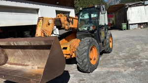 Radlader mit Schneeketten und JCB TELELADER