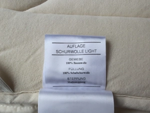Hüslernest Schafwollunterbetten zu verschenken Bild 3