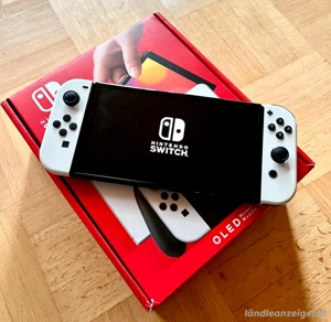 Nintendo Switch Oled Weiß mit 7 Spielen  Bild 2