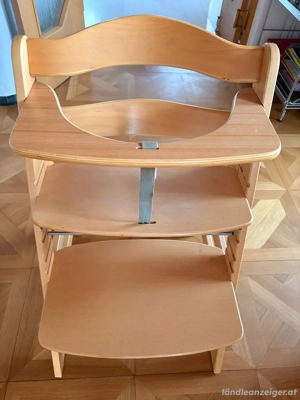 Kinderhochstuhl und Tischauflage