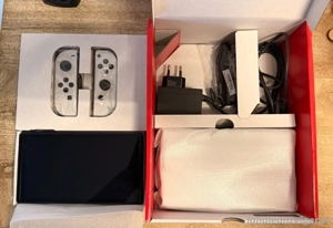 Nintendo Switch OLED-Modell, Weiß, Inkl. 4 Joy Cons, 2 Spiele, 256GB und mehr.. Bild 5