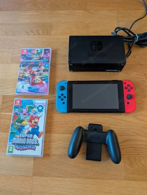 Nintendo Switch + Zubehör + Mariokart + Super Mario Bild 2