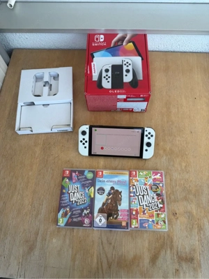 nintendo switch oled mit 3 spiele  Bild 3