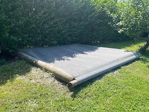 Sandkasten aus Rund-Pallisaden Bild 2