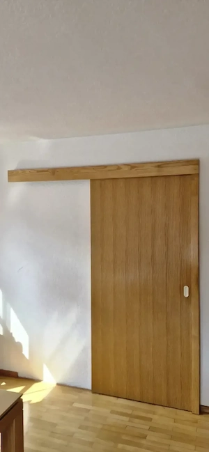 Massive Schiebetüre in Esche inklusive Türrahmen Bild 2