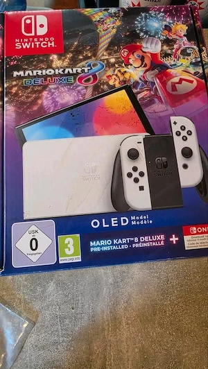Nintendo Switch OLED mit drei Mario Spielen und Zubehör Bild 3