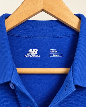 New Balance Herren Poloshirt Blau Größe S Bild 6
