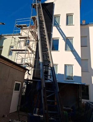 Ein 26 m langer Dachaufzug, ein Honda-Motor und ein Ziegeladapter.  Bild 3