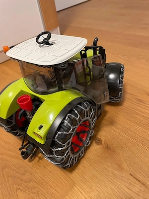 Bruder Claas Axion 950 mit Schneeketten und Pflug - Bruder 3018 Bild 4