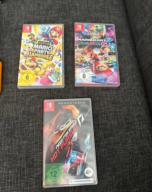 Nintendo Switch mit 3 Spiele und 2 Joy-Con Bild 3