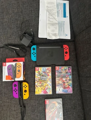 Nintendo Switch mit 3 Spiele und 2 Joy-Con Bild 4