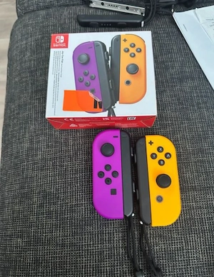 Nintendo Switch mit 3 Spiele und 2 Joy-Con Bild 2