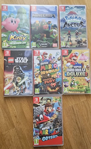 Nintendo Switch mit 7 Spielen, 4 Joy-Cons und Zubehör - Komplettset Bild 3